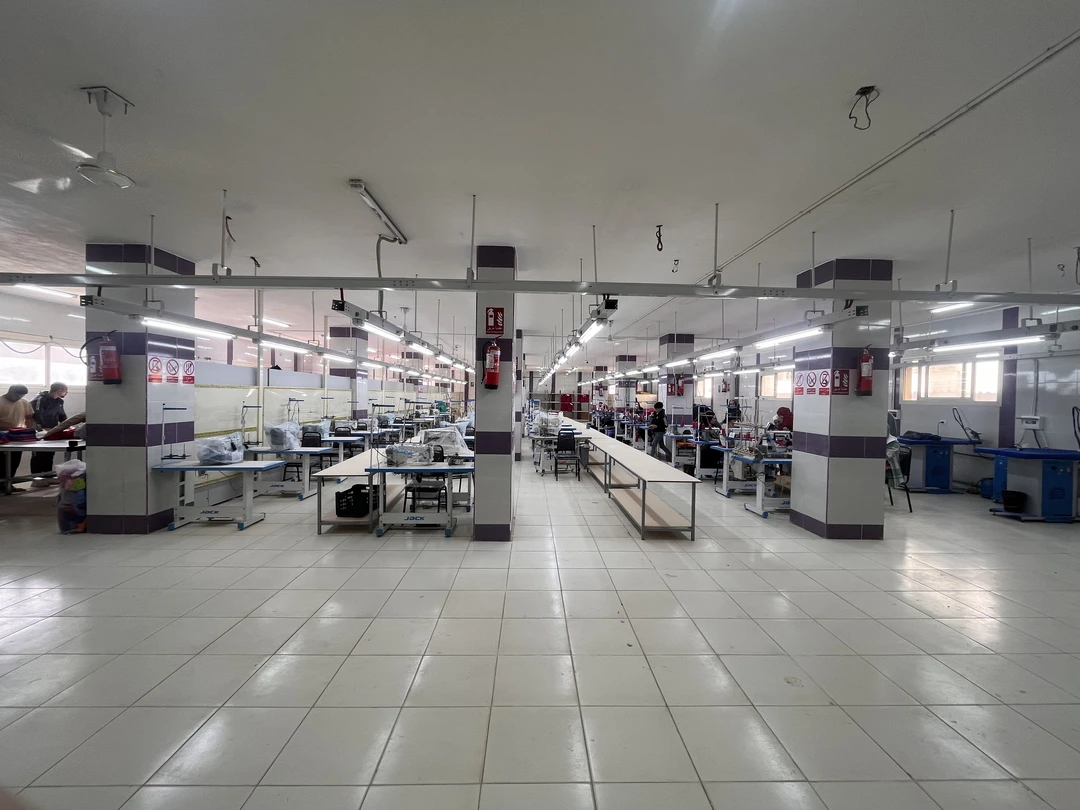 Large sewing production hall with many machines and workstations